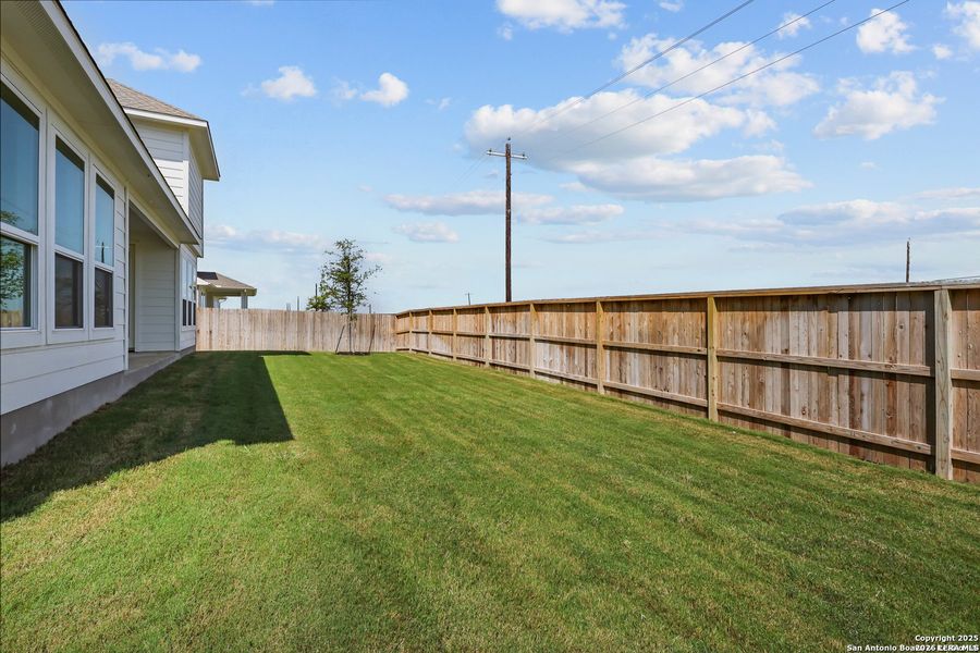 Exterior details and patio area of a home in Megan's Landing, Castroville (Image 3).