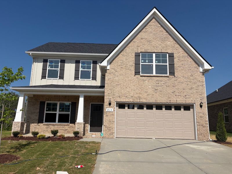 Front exterior of a new home in Brandon Woods, Spring Hill, TN, highlighting curb appeal (Image 1). Front exterior of a new home in Brandon Woods, Spring Hill, TN, highlighting curb appeal (Image 1).