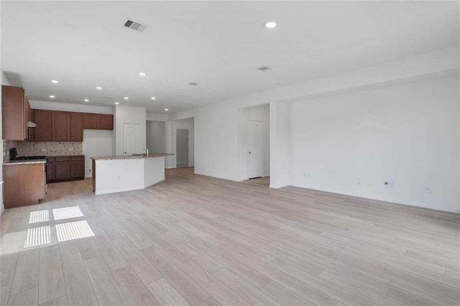 Additional view from the family room looking towards the kitchen and dining areas.