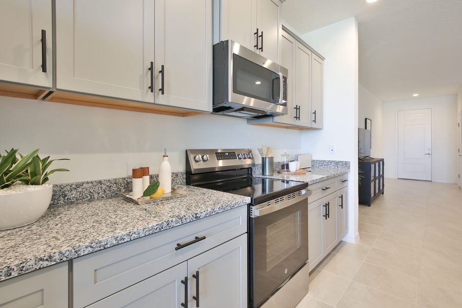 Representative furnished interior of a home built from the Morgan by Neal Communities in SkySail, Naples (Image 24).
