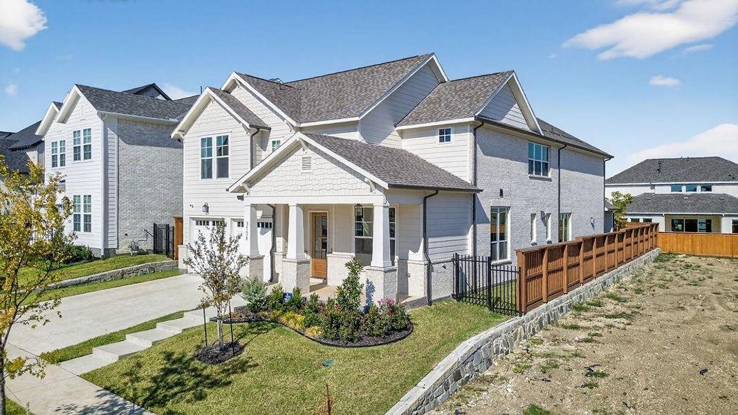 View of front of home with a porch, driveway, an attached garage, and a shingled roof View of front of home with a porch, driveway, an attached garage, and a shingled roof