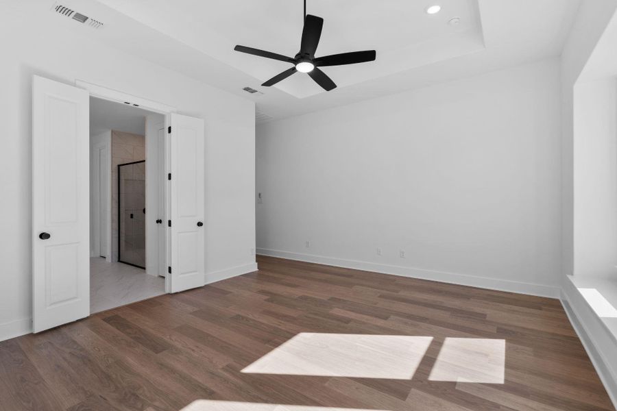 Primary Bedroom with tray ceiling