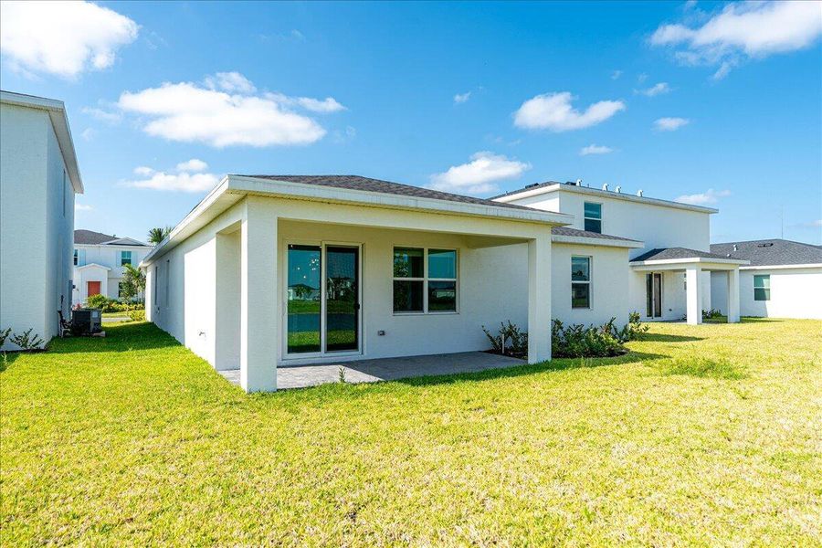 Front exterior of a new home in Seagrove: The Indies, Fort Pierce, FL, highlighting curb appeal (Image 2).