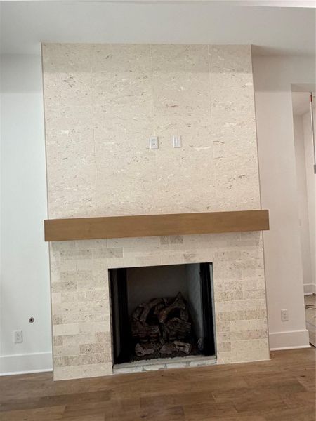 Gas fireplace with Travertine & mantle in Great Room Gas fireplace with Travertine & mantle in Great Room
