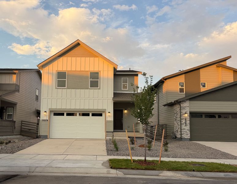 Front exterior of a new home in Legato, Commerce City, CO, highlighting curb appeal (Image 1). Front exterior of a new home in Legato, Commerce City, CO, highlighting curb appeal (Image 1).