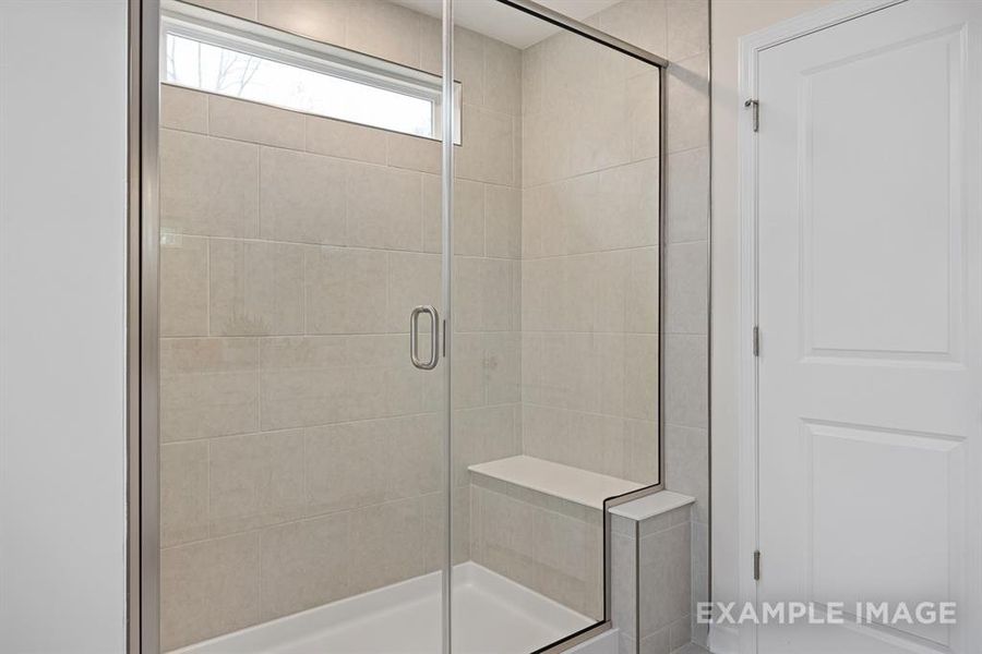 Bathroom with a shower with shower door