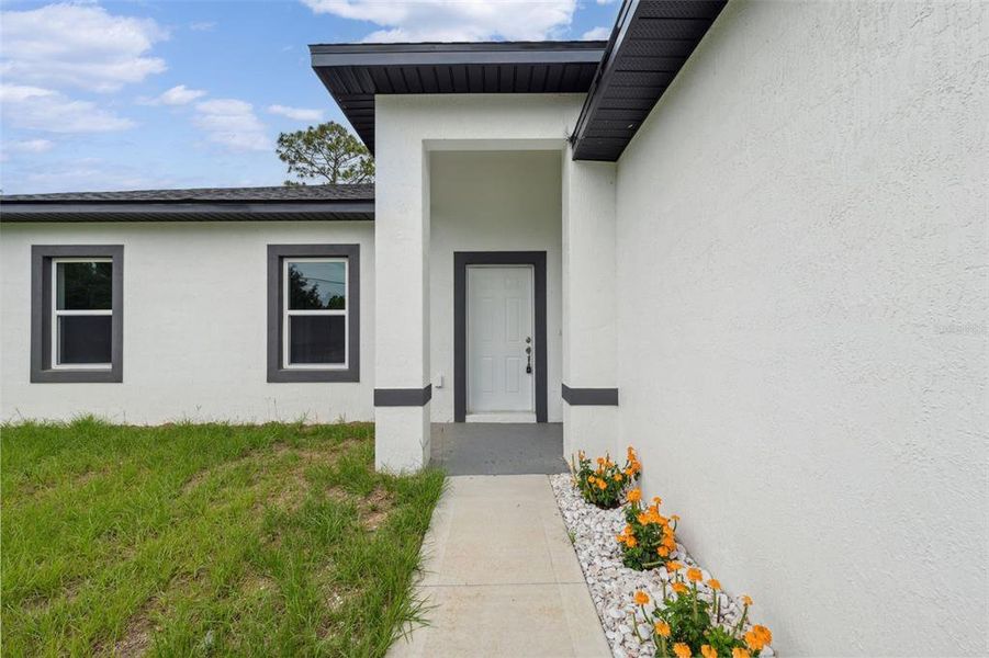 Front exterior of a new home in , Citrus Springs, FL, highlighting curb appeal (Image 25).