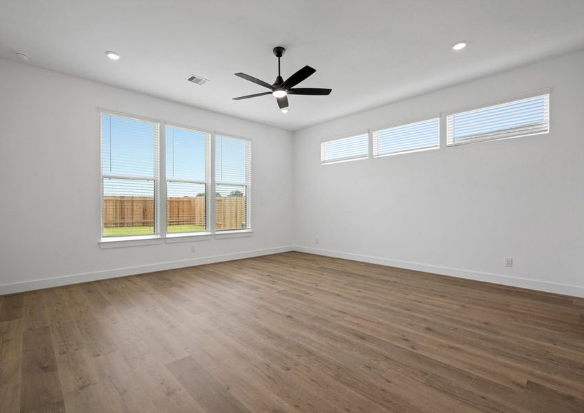 Relax in the stunning primary bedroom.