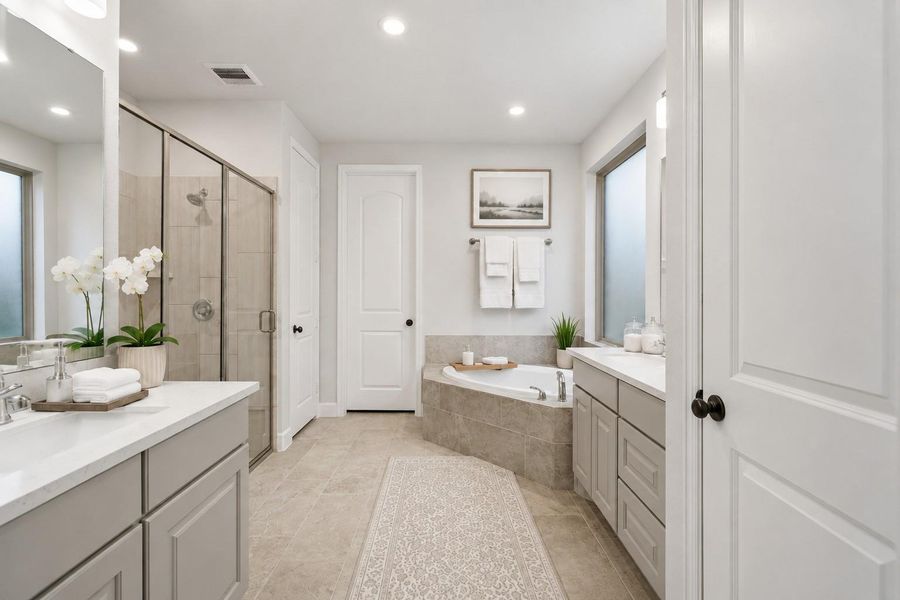 This bathroom features a modern design with neutral tones, a spacious walk-in shower, and a luxurious corner bathtub. It includes dual vanities with ample storage and stylish accents, creating a serene and functional space. This bathroom features a modern design with neutral tones, a spacious walk-in shower, and a luxurious corner bathtub. It includes dual vanities with ample storage and stylish accents, creating a serene and functional space.