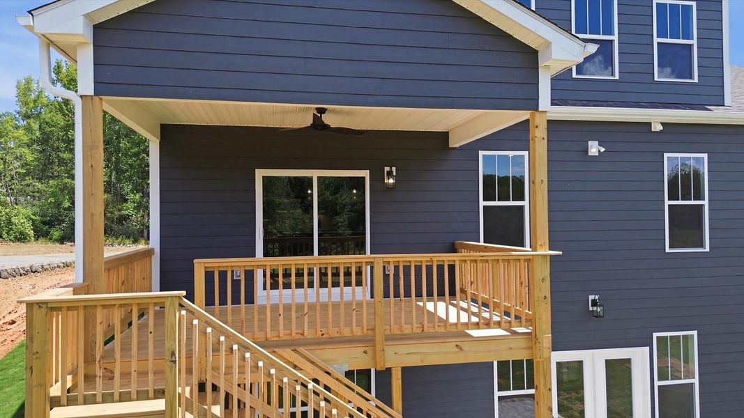 Exclusive rear covered deck with accomplished detail and elevated outdoor living potential in Woodruff, SC