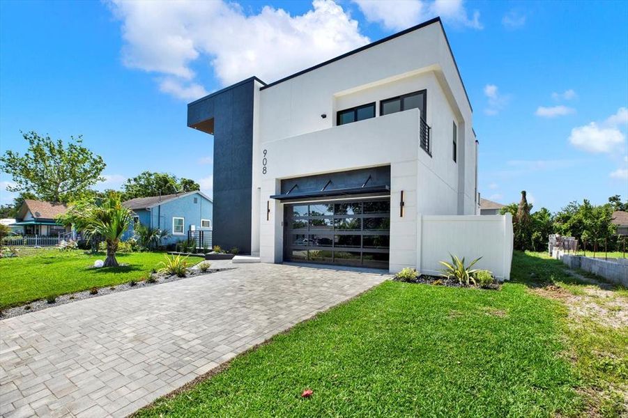 Front exterior of a new home in , Tampa, FL, highlighting curb appeal (Image 1).