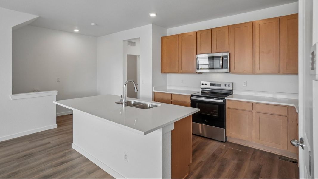 Kitchen with cabinetry, countertops, island, and modern finishes. Kitchen with cabinetry, countertops, island, and modern finishes.