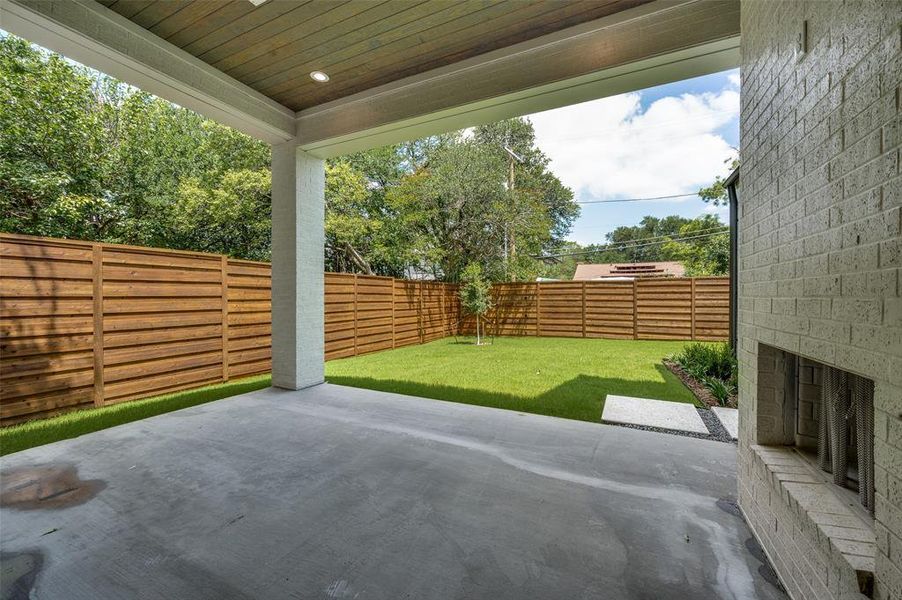 Fenced backyard featuring a patio area