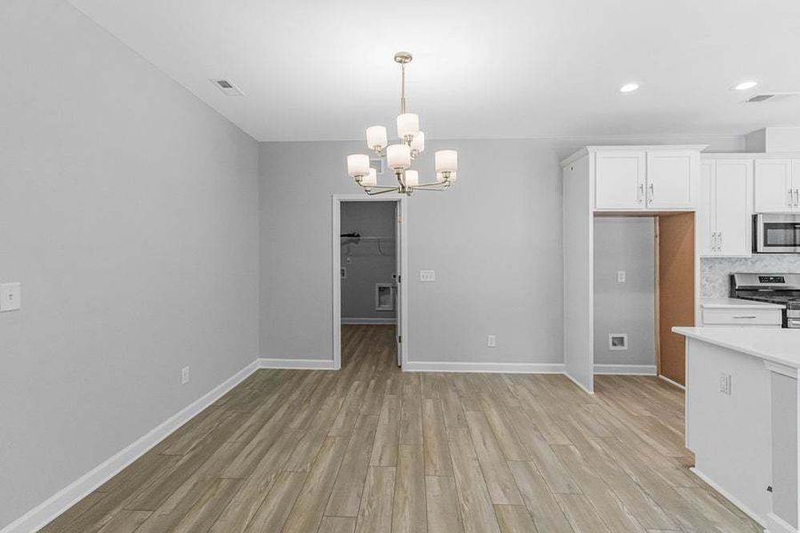 Representative unfurnished interior of a home built from the Weymouth by Caviness & Cates Communities in Bartlett Manor, Youngsville (Image 50).