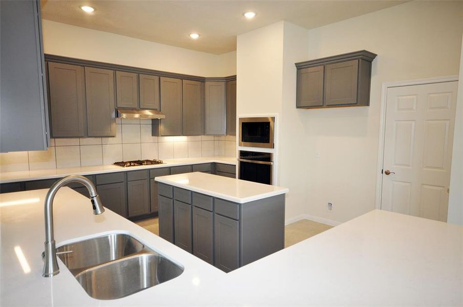 Open and loaded with storage is this island kitchen.