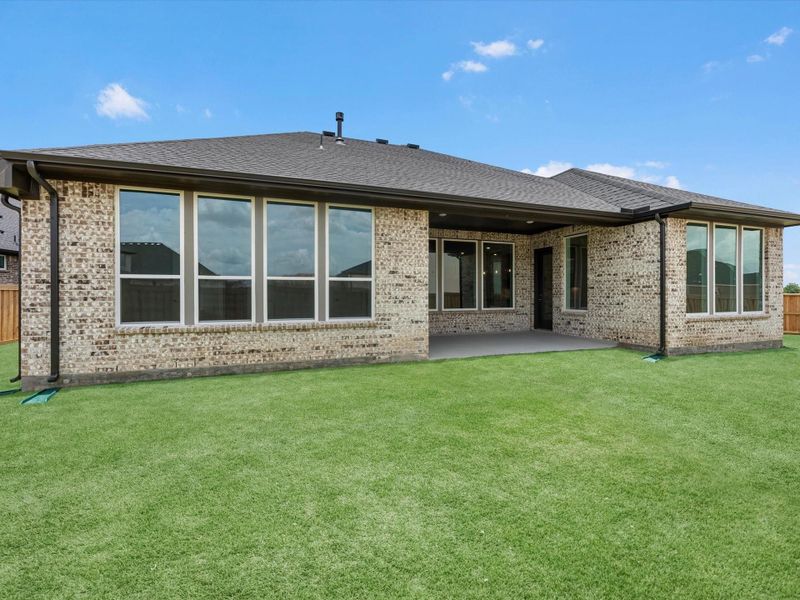 Exterior details and patio area of a home in Dunham Pointe, Cypress (Image 3).
