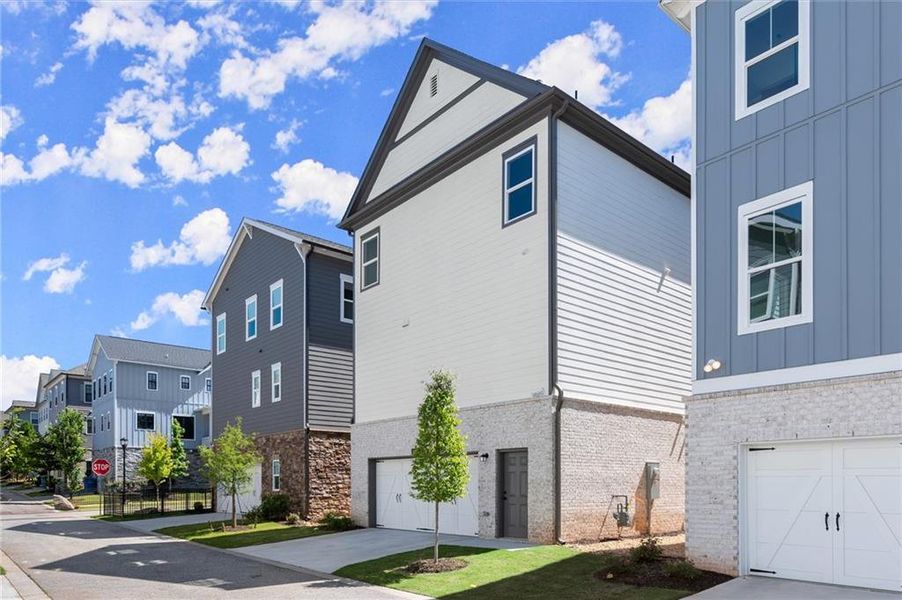 Front exterior of a new home in West Town, Atlanta, GA, highlighting curb appeal (Image 26). Front exterior of a new home in West Town, Atlanta, GA, highlighting curb appeal (Image 26).