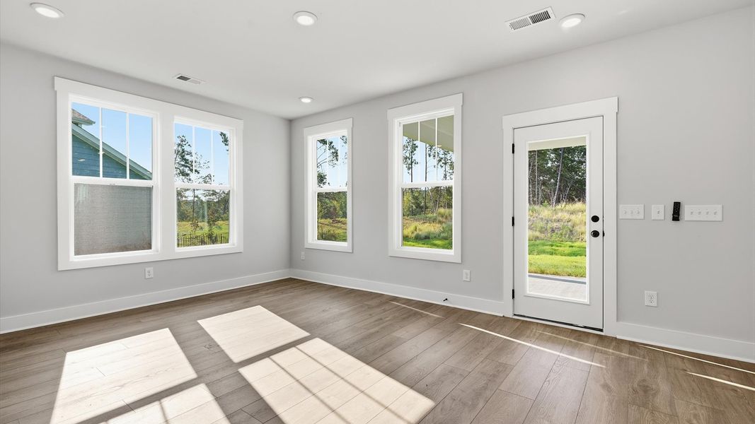 Inviting breakfast nook filled with natural light in this thoughtfully designed home