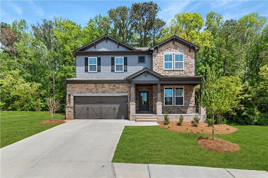 Front exterior of a new home in The Paddocks at Doc Hughes, Buford, GA, highlighting curb appeal (Image 19). Front exterior of a new home in The Paddocks at Doc Hughes, Buford, GA, highlighting curb appeal (Image 19).