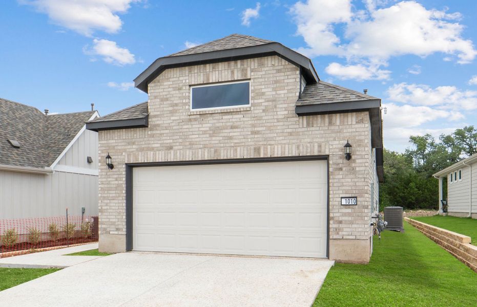 Front exterior of a new home in Sun City Texas, Georgetown, TX, highlighting curb appeal (Image 19).