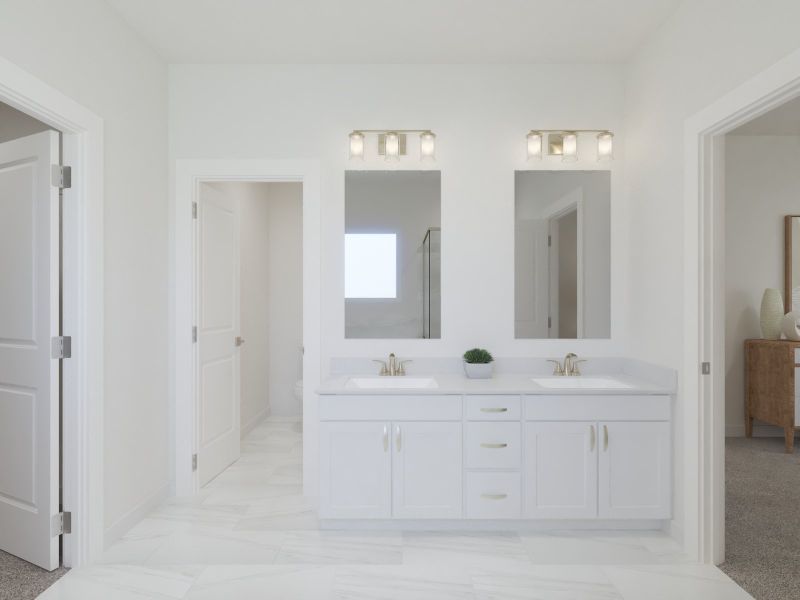The primary bathroom offers dual vanity sinks and a walk-in shower. The primary bathroom offers dual vanity sinks and a walk-in shower.