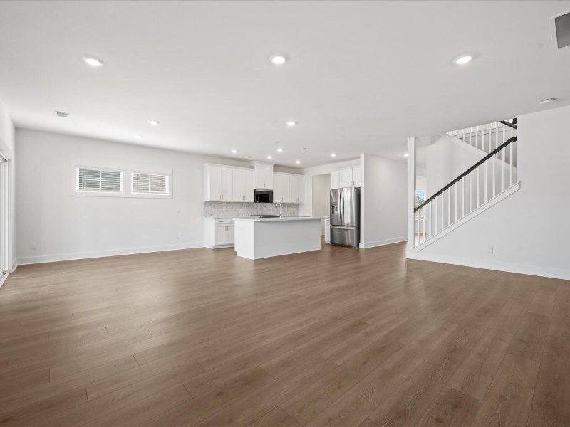 Spacious, unfurnished interior of a new home in The Coves at Lakes of Cane Bay, Summerville (Image 10).