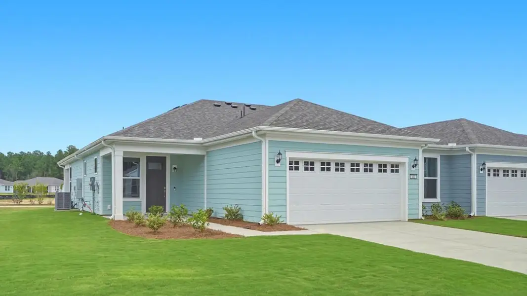 Front exterior of a new home in Sun City Hilton Head, Bluffton, SC, highlighting curb appeal (Image 2). Front exterior of a new home in Sun City Hilton Head, Bluffton, SC, highlighting curb appeal (Image 2).