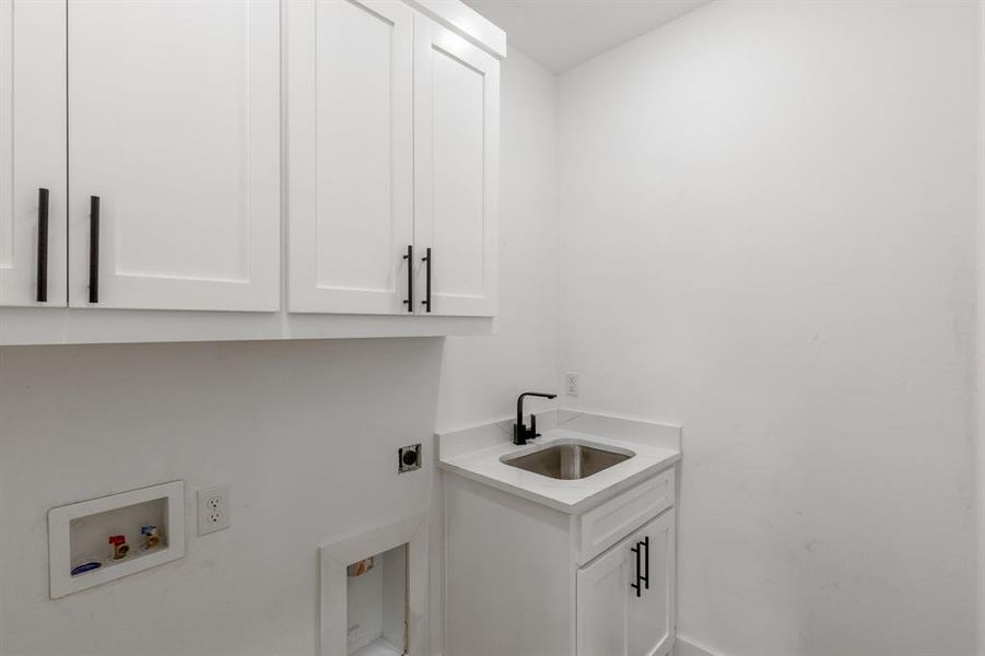 Laundry area with washer hookup, sink, cabinets, and electric dryer hookup