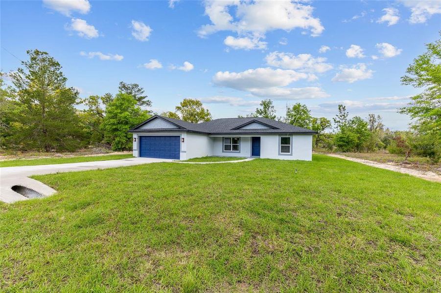 Front exterior of a new home in , Ocklawaha, FL, highlighting curb appeal (Image 23).
