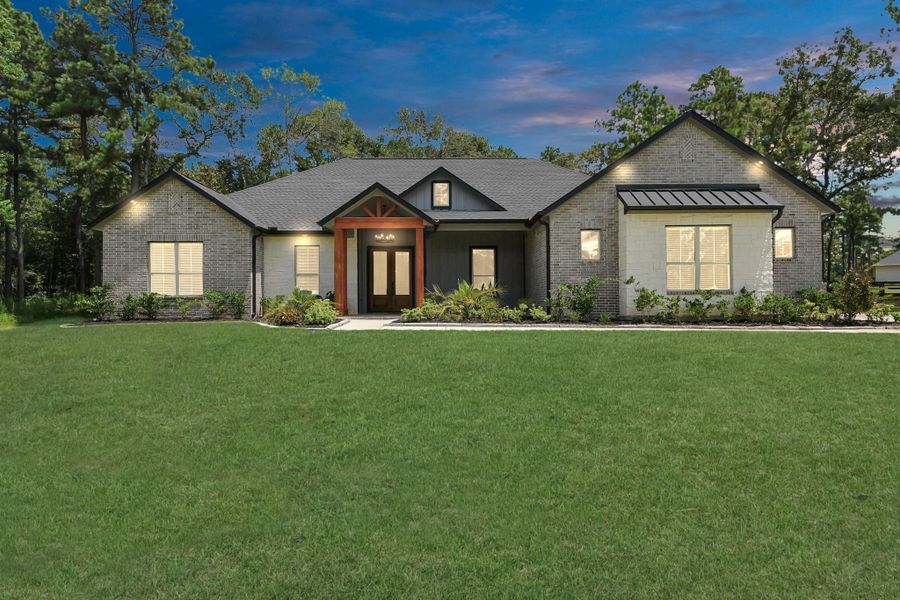 Front exterior of a new home in , Magnolia, TX, highlighting curb appeal (Image 2).