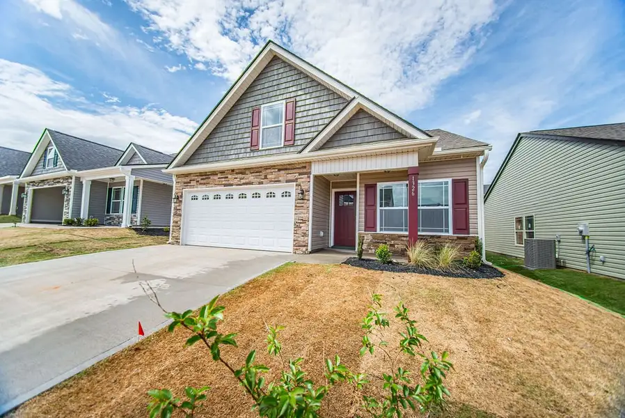 Representative exterior photo of a completed home built from the Quincy by Enchanted Homes in Hampshire Heights, Moore, SC (Image 2).