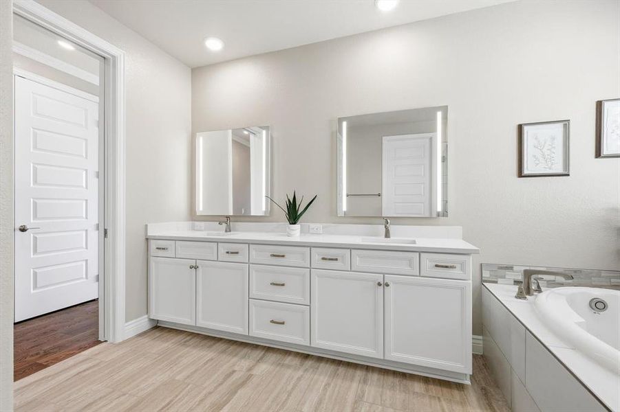 Master Bath with double vanity and lighted mirrors