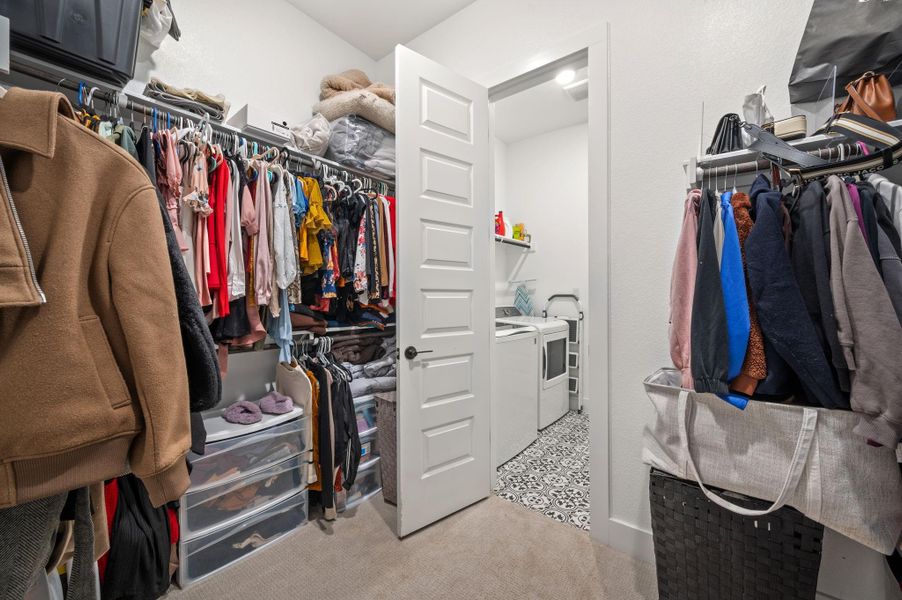 Primary closet with pass through to laundry room