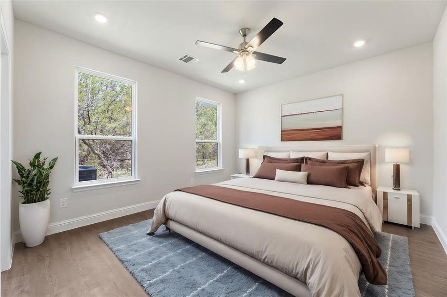 Bedroom featuring dark wood-type flooring and ceiling fan