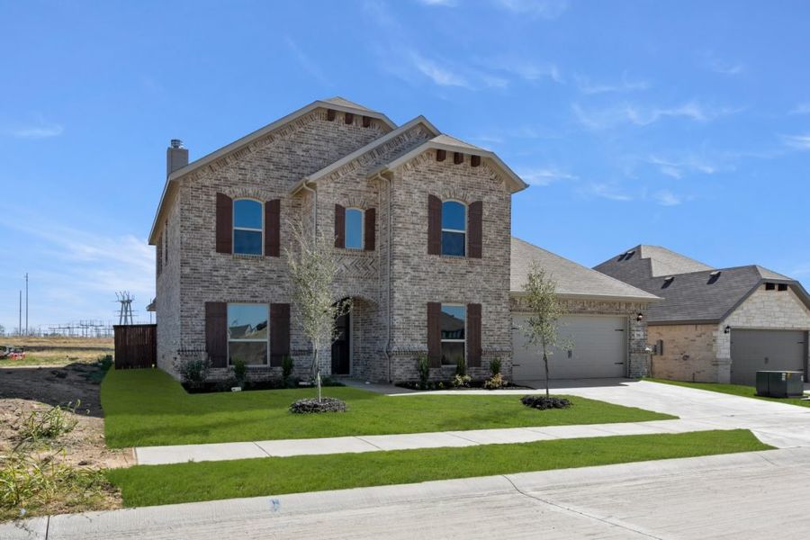 Representative exterior photo of a completed home built from the Radcliffe by Impression Homes in Timberbrook, Justin, TX (Image 2).