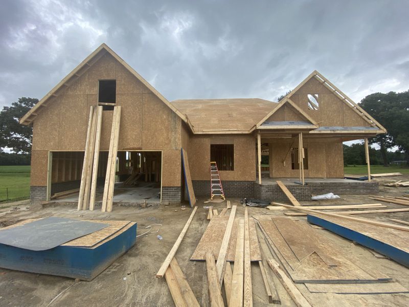 Front exterior of a new home in Kennedy's Crossing, Grimesland, NC, highlighting curb appeal (Image 1). Front exterior of a new home in Kennedy's Crossing, Grimesland, NC, highlighting curb appeal (Image 1).