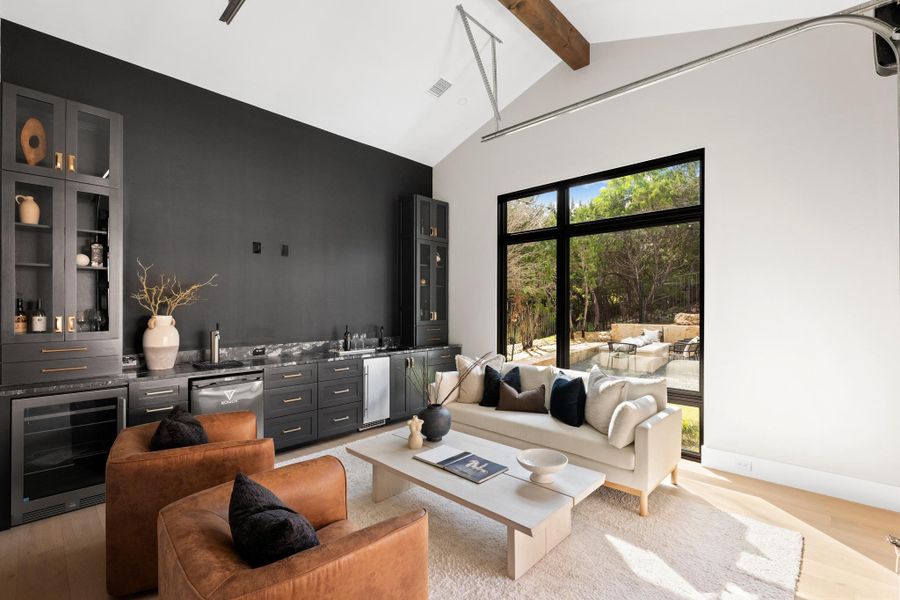 The ultimate entertainment hub, this game room features a wet bar equipped with a dedicated wine and beverage fridge