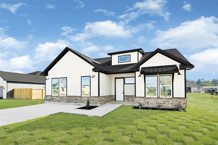 Front exterior of a new home in , Huffman, TX, highlighting curb appeal (Image 25).