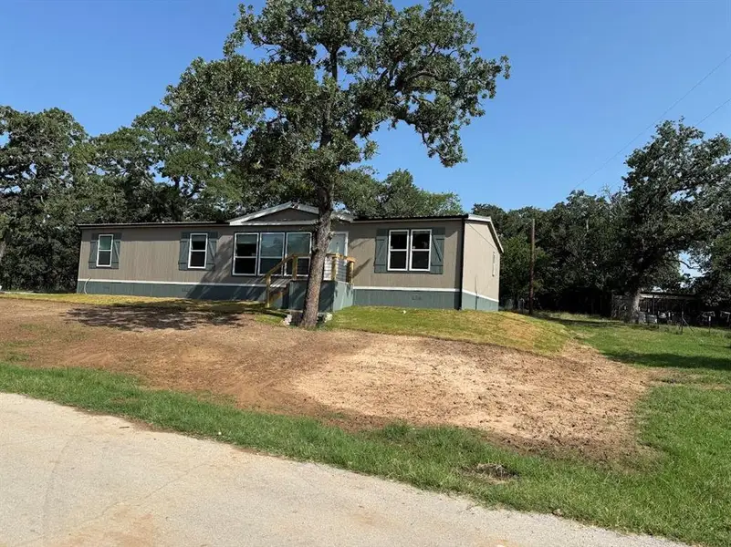 Exterior details and patio area of a home in , Pelican Bay (Image 11).