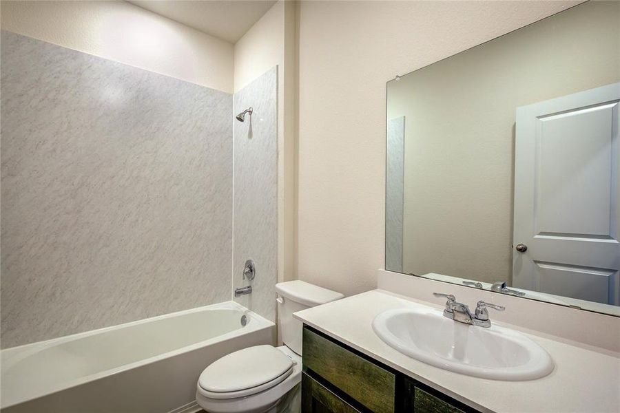 Bathroom featuring shower / bath combination and vanity