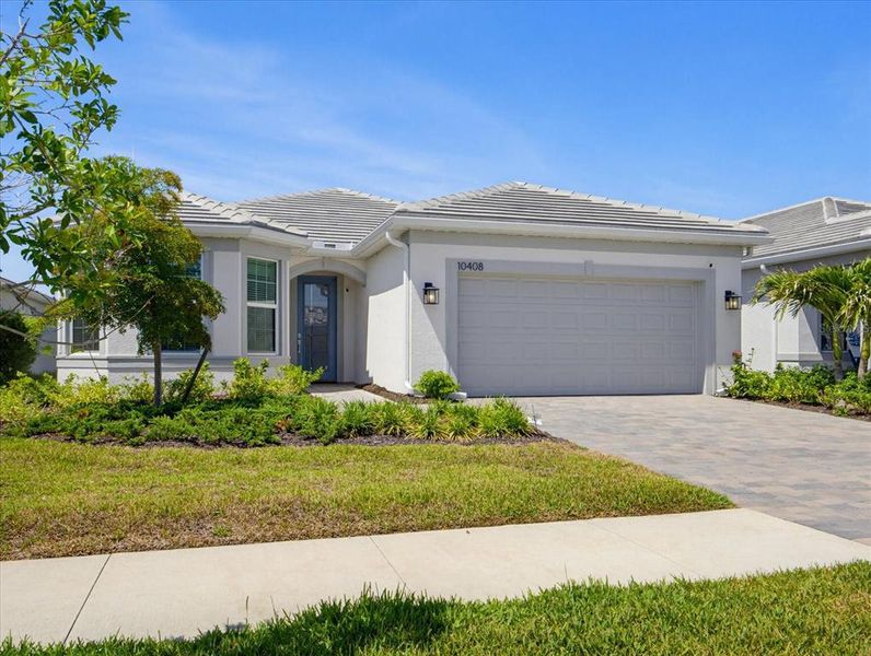 Front exterior of a new home in , Englewood, FL, highlighting curb appeal (Image 26). Front exterior of a new home in , Englewood, FL, highlighting curb appeal (Image 26).