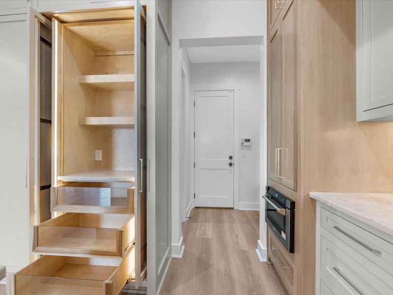 You'll find custom cabinetry throughout, but the details here are; white oak cabinetry, glass face cabinets, luxury appliances, and much much more.