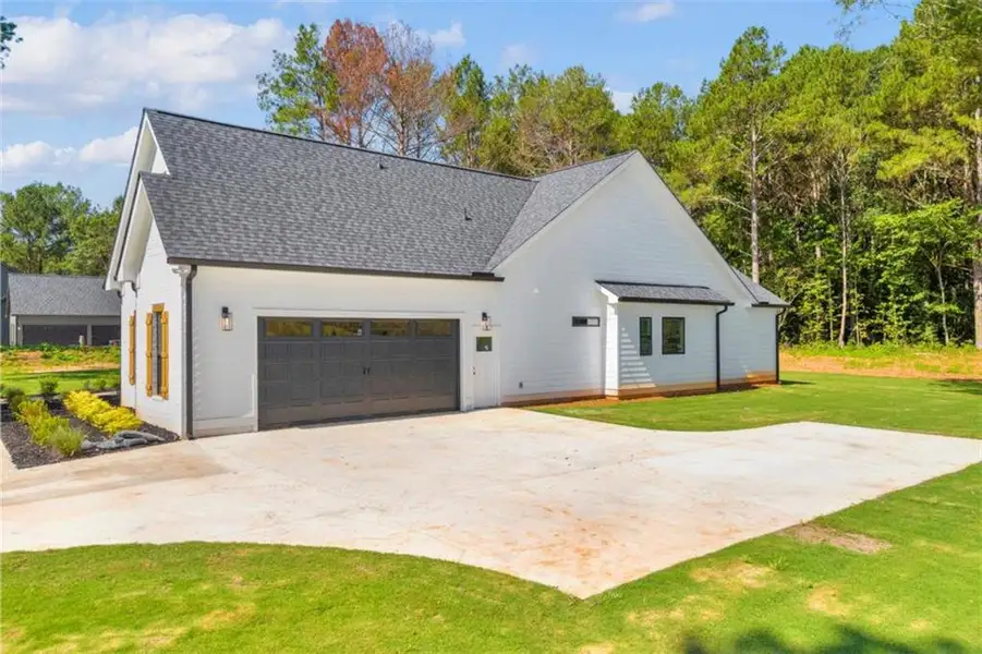 Front exterior of a new home in , Covington, GA, highlighting curb appeal (Image 30). Front exterior of a new home in , Covington, GA, highlighting curb appeal (Image 30).