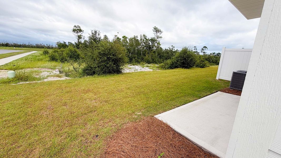 Exterior details and patio area of a home in Salt Creek Townhomes at Mexico Beach, Mexico Beach (Image 20).