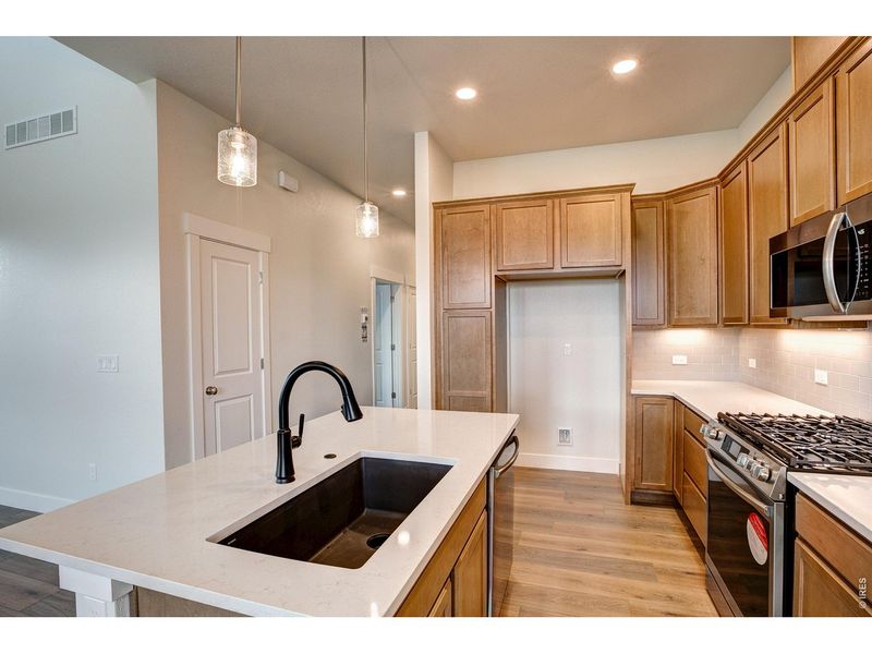 Furnished interior view inside a new home in The Lakes at Centerra - The Shores, Loveland (Image 9).