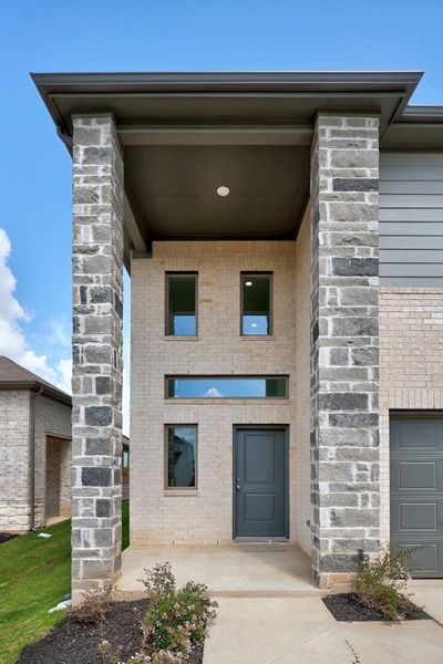 Exterior details and patio area of a home in Trinity Ranch, Elgin (Image 24). Exterior details and patio area of a home in Trinity Ranch, Elgin (Image 24).