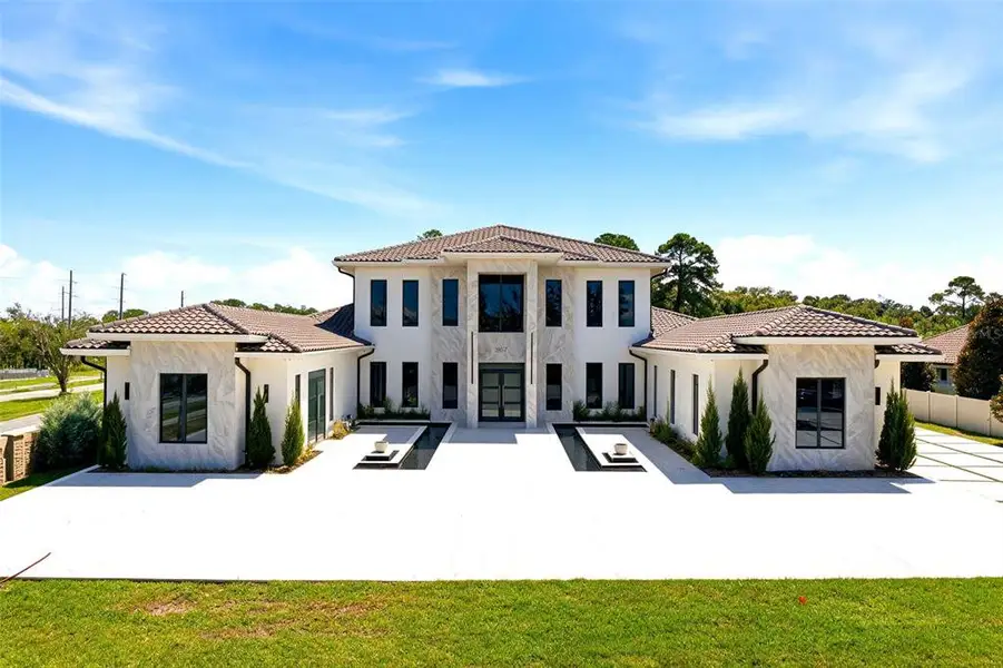 Front exterior of a new home in , Lake Mary, FL, highlighting curb appeal (Image 1). Front exterior of a new home in , Lake Mary, FL, highlighting curb appeal (Image 1).