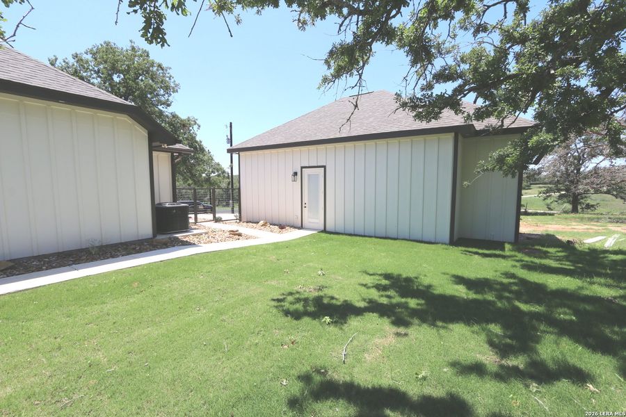 Exterior details and patio area of a home in , La Vernia (Image 32).