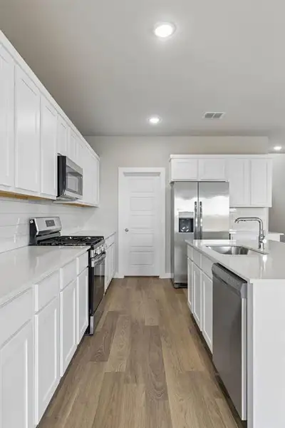 Kitchen in the Winters home plan by Trophy Signature Homes – REPRESENTATIVE PHOTO