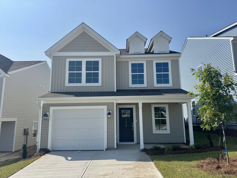 Front exterior of a new home in Ellington, Elgin, SC, highlighting curb appeal (Image 1). Front exterior of a new home in Ellington, Elgin, SC, highlighting curb appeal (Image 1).
